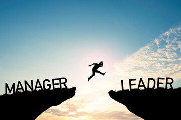 A person jumps between cliffs labeled Manager and Leader.
