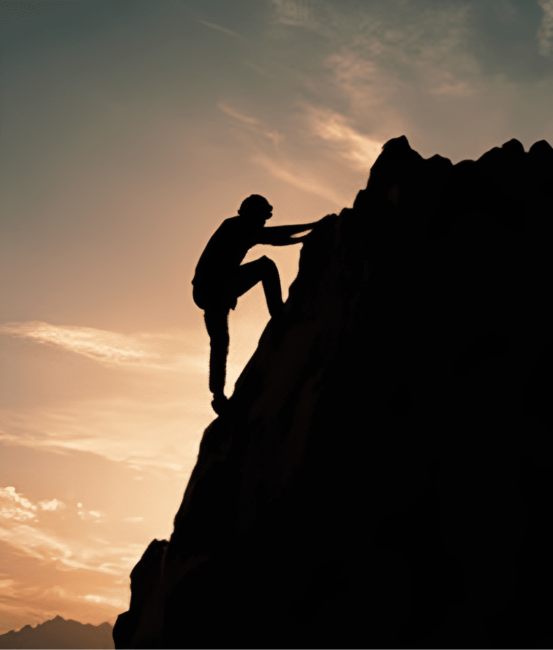 Silhouette of climber on rocky cliff