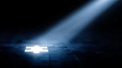 A bright light beam illuminating a glowing puzzle piece in darkness.